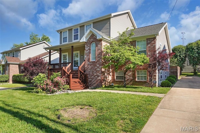 385 E Clinton Pl, Saint Louis, MO 63122 - traditional-style house featuring brick siding, covered porch, a front yard, and stairway