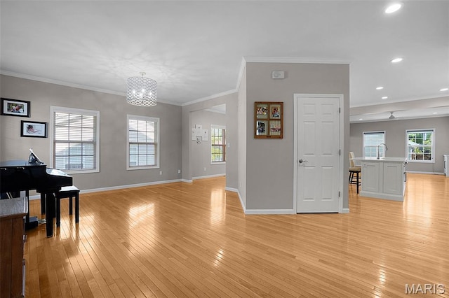 385 E Clinton Pl, Saint Louis, MO 63122 - living area with light wood-type flooring, a chandelier, baseboards, crown molding, and recessed lighting