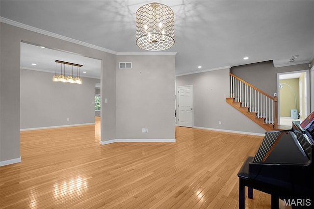 385 E Clinton Pl, Saint Louis, MO 63122 - living area featuring light wood-type flooring, a chandelier, ornamental molding, recessed lighting, and stairway