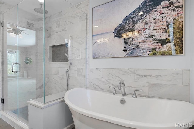385 E Clinton Pl, Saint Louis, MO 63122 - full bathroom featuring a stall shower, a freestanding bath, and tile walls