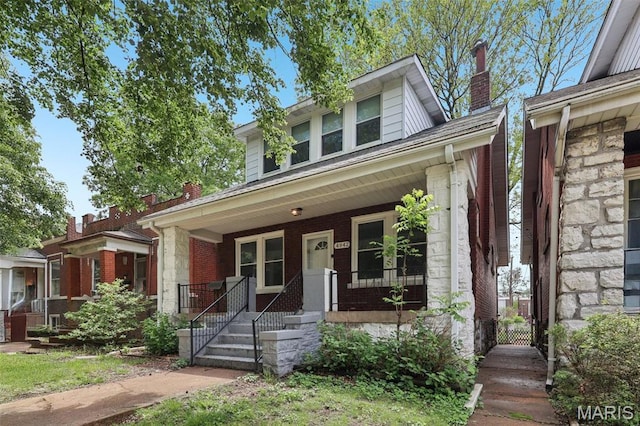 4942 Bonita Ave, Saint Louis, MO 63109 - american foursquare style home with a porch, a chimney, and brick siding