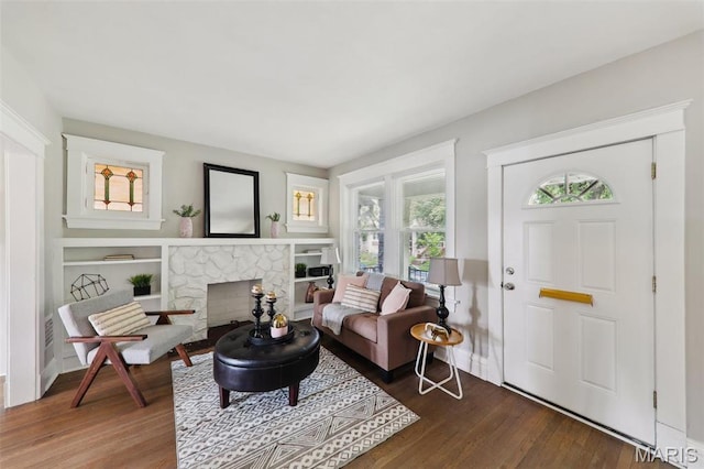 4942 Bonita Ave, Saint Louis, MO 63109 - living area with dark wood-style floors and a fireplace