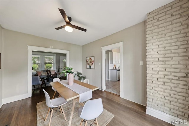 4942 Bonita Ave, Saint Louis, MO 63109 - dining space featuring a ceiling fan, baseboards, and wood finished floors