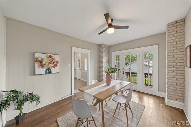 4942 Bonita Ave, Saint Louis, MO 63109 - dining space featuring wood finished floors, a ceiling fan, and baseboards
