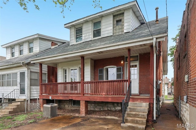 4942 Bonita Ave, Saint Louis, MO 63109 - view of front of house featuring a porch, central air condition unit, and roof with shingles