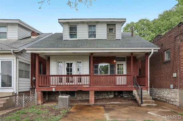 4942 Bonita Ave, Saint Louis, MO 63109 - view of front of home with central AC unit, roof with shingles, and covered porch