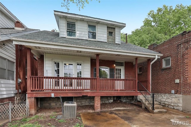 4942 Bonita Ave, Saint Louis, MO 63109 - view of front of home featuring covered porch, cooling unit, and roof with shingles