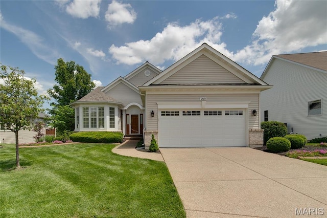 view of front facade featuring an attached garage, driveway, a front yard, and brick siding