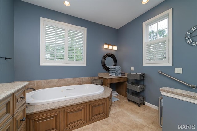 full bath with a bath and recessed lighting