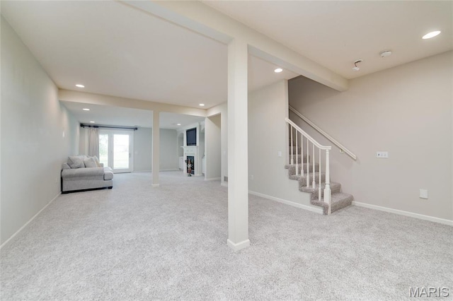 basement featuring carpet floors, recessed lighting, stairway, baseboards, and a fireplace