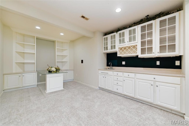 kitchen with open shelves, recessed lighting, white cabinets, glass insert cabinets, and baseboards
