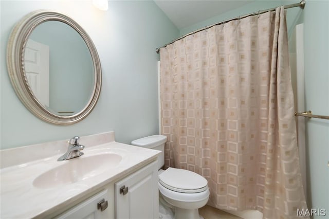 full bathroom with toilet, vanity, and a shower with shower curtain