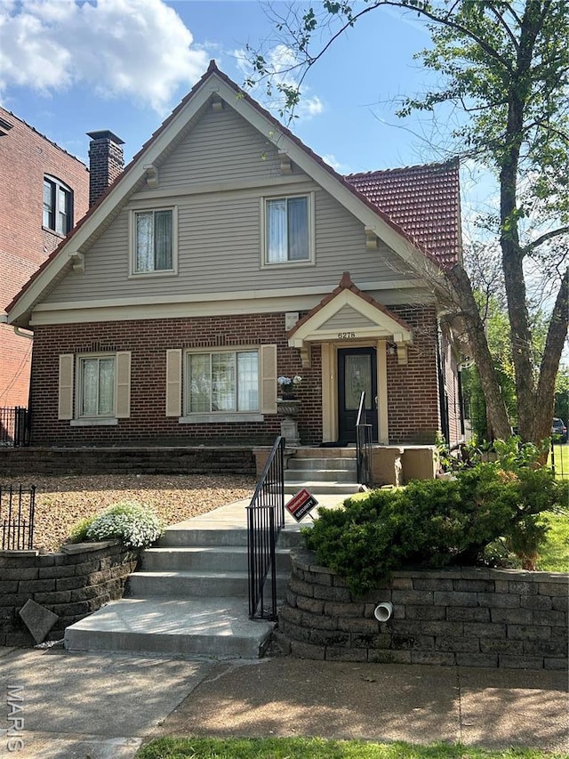 6278 Cates Ave, Saint Louis, MO 63130 - view of front of property featuring brick siding and a chimney