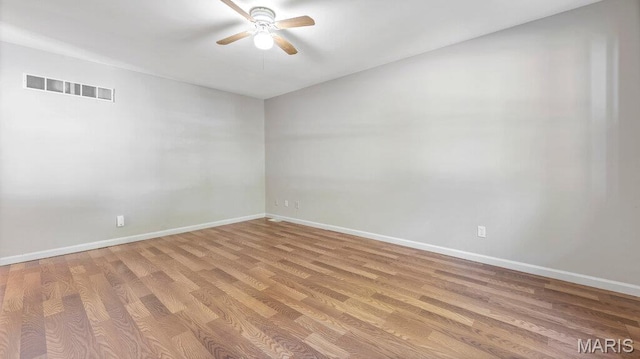 939 Vosholl Ave, Warrenton, MO 63383 - unfurnished room with ceiling fan, baseboards, and light wood-style flooring