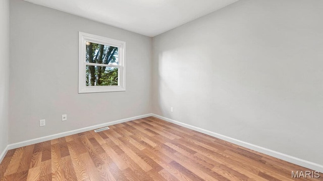 939 Vosholl Ave, Warrenton, MO 63383 - unfurnished room with baseboards and light wood-style floors