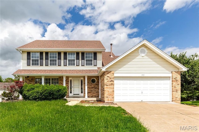 200 Kylewood Ct, Ballwin, MO 63021 - traditional home with concrete driveway, an attached garage, and brick siding