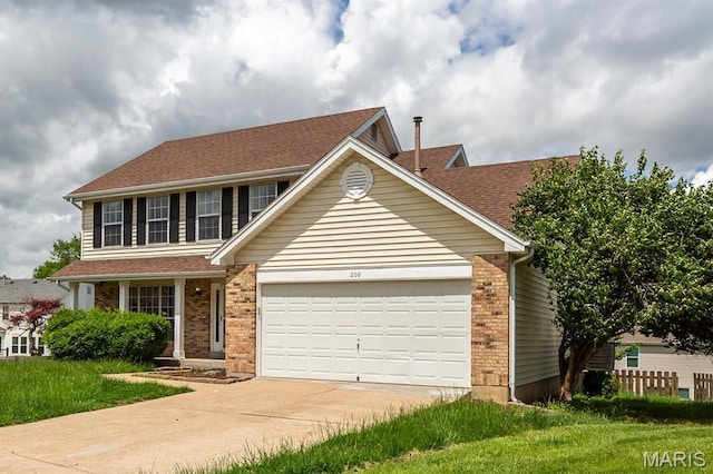 200 Kylewood Ct, Ballwin, MO 63021 - traditional home with concrete driveway, an attached garage, brick siding, and roof with shingles