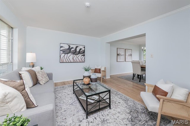 200 Kylewood Ct, Ballwin, MO 63021 - living room featuring crown molding, wood finished floors, baseboards, and a chandelier