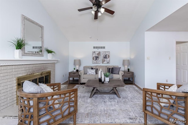 200 Kylewood Ct, Ballwin, MO 63021 - living room with vaulted ceiling, a ceiling fan, a fireplace, and baseboards