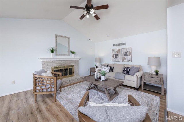 200 Kylewood Ct, Ballwin, MO 63021 - living area featuring a ceiling fan, wood finished floors, lofted ceiling, a fireplace, and baseboards
