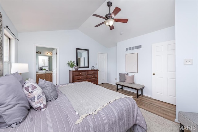 200 Kylewood Ct, Ballwin, MO 63021 - bedroom with vaulted ceiling, wood finished floors, a ceiling fan, and ensuite bath