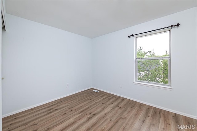 200 Kylewood Ct, Ballwin, MO 63021 - empty room with wood finished floors and baseboards