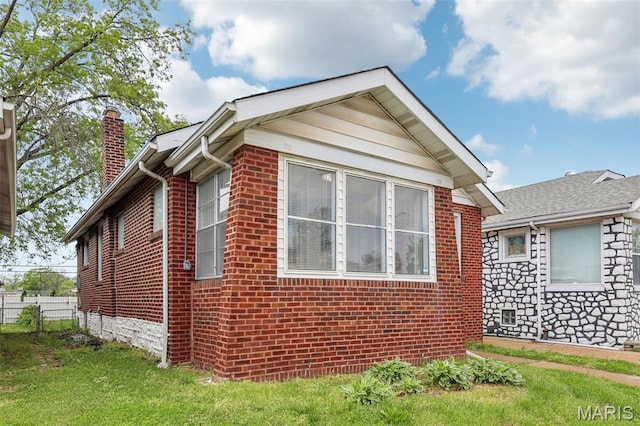 5909 Hampton Ave, Saint Louis, MO 63109 - view of side of property with a chimney and brick siding