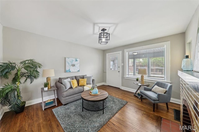 5909 Hampton Ave, Saint Louis, MO 63109 - living room featuring baseboards and wood finished floors