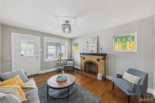 5909 Hampton Ave, Saint Louis, MO 63109 - living room with baseboards, wood finished floors, and a fireplace