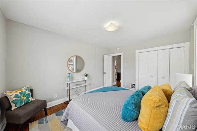 5909 Hampton Ave, Saint Louis, MO 63109 - bedroom with baseboards, wood finished floors, and a closet