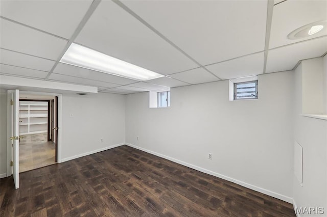 5909 Hampton Ave, Saint Louis, MO 63109 - below grade area with wood finished floors, plenty of natural light, baseboards, and a drop ceiling