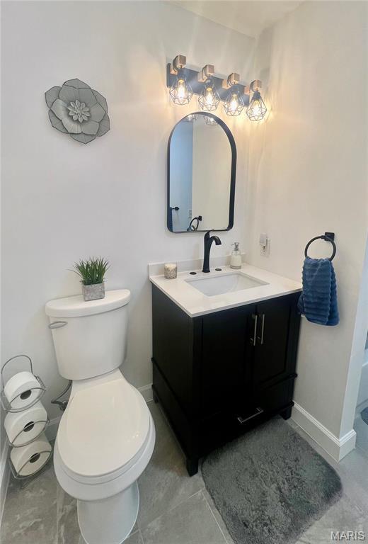 3605 Tracey Rich Rd Unit 1A, Saint Louis, MO 63125 - bathroom with vanity, toilet, and baseboards
