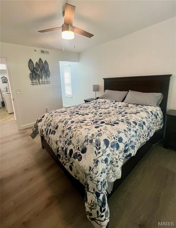 3605 Tracey Rich Rd Unit 1A, Saint Louis, MO 63125 - bedroom featuring wood finished floors, baseboards, and ceiling fan