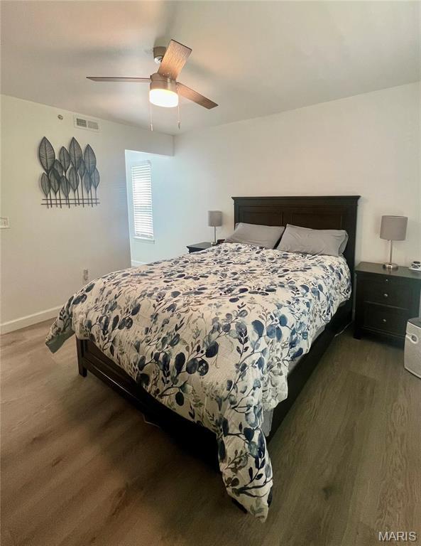 3605 Tracey Rich Rd Unit 1A, Saint Louis, MO 63125 - bedroom with wood finished floors, baseboards, and ceiling fan