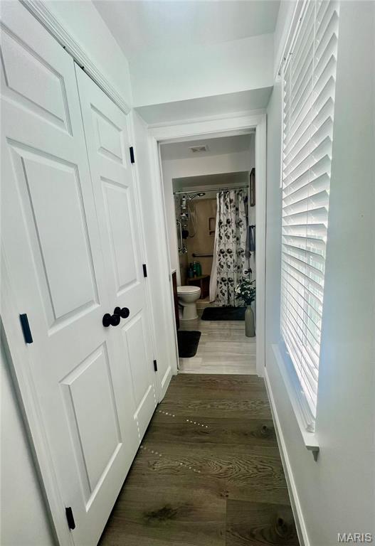 3605 Tracey Rich Rd Unit 1A, Saint Louis, MO 63125 - hallway featuring wood finished floors