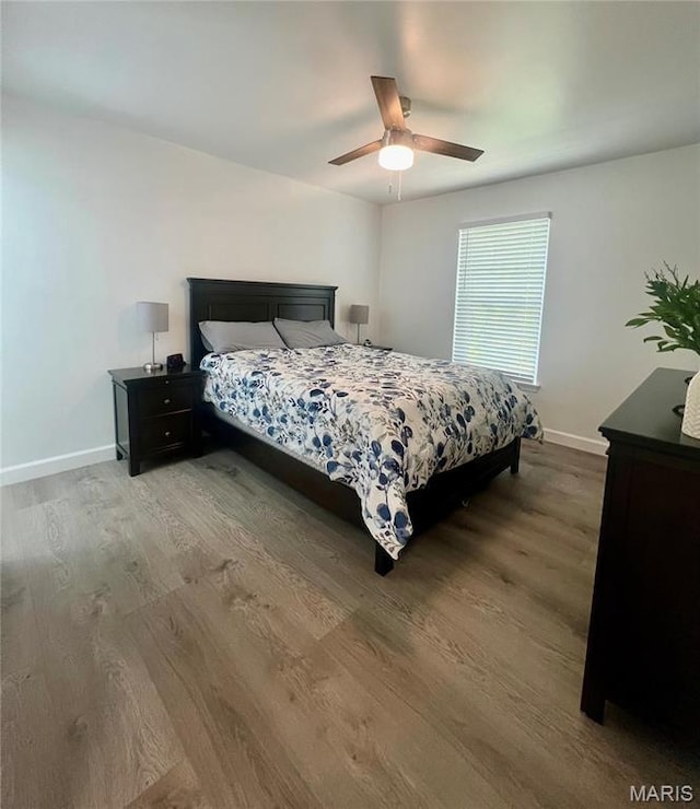 3605 Tracey Rich Rd Unit 1A, Saint Louis, MO 63125 - bedroom with wood finished floors, baseboards, and a ceiling fan