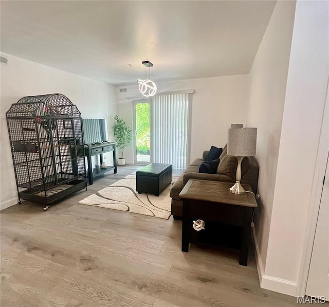 3605 Tracey Rich Rd Unit 1A, Saint Louis, MO 63125 - living area with wood finished floors and baseboards