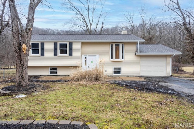5604 Mark Trl, House Springs, MO 63051 - bi-level home featuring a garage, driveway, a chimney, roof with shingles, and a front lawn