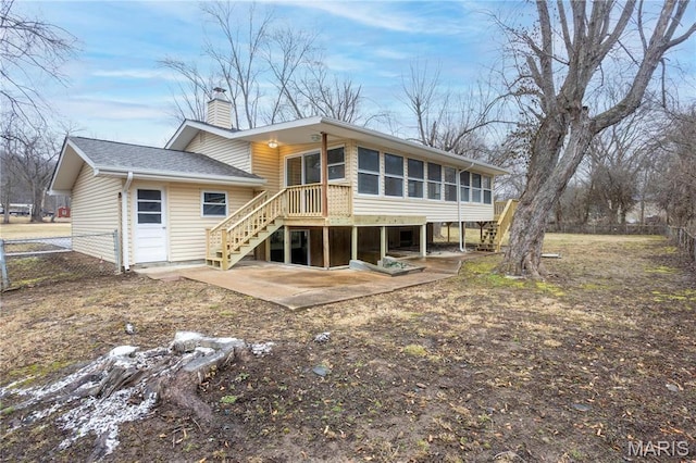5604 Mark Trl, House Springs, MO 63051 - rear view of property with a chimney, a sunroom, a patio, fence, and a shingled roof