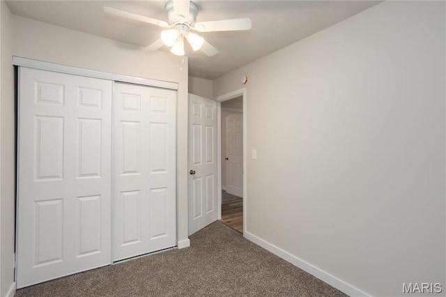 5604 Mark Trl, House Springs, MO 63051 - unfurnished bedroom with dark colored carpet, baseboards, a closet, and ceiling fan