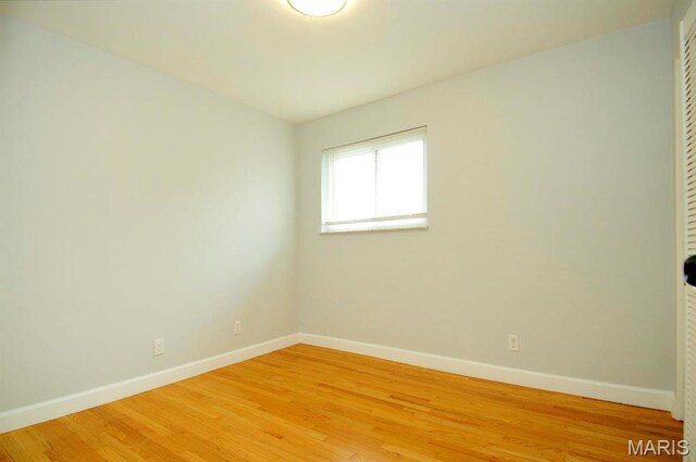 7051 Lansdowne Ave, Saint Louis, MO 63109 - unfurnished room featuring baseboards and light wood finished floors