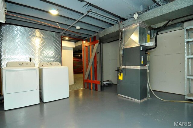 7051 Lansdowne Ave, Saint Louis, MO 63109 - unfinished basement with heating unit and independent washer and dryer