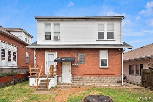 view of front of property featuring brick siding