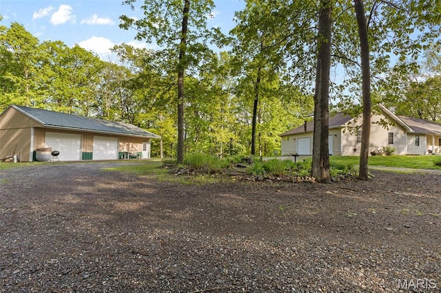 102 Timber Ln, Farmington, MO 63640 - view of yard featuring a detached garage and an outbuilding