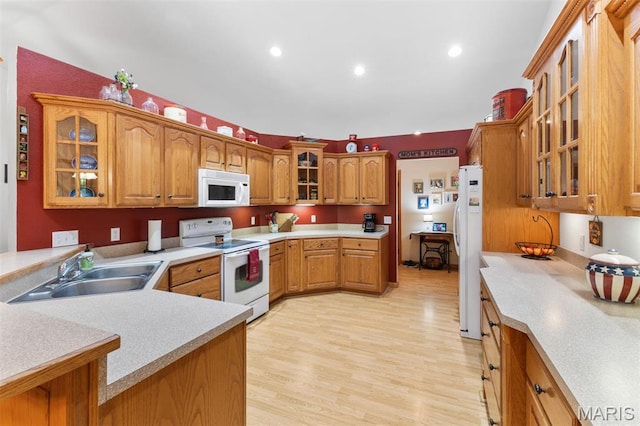 102 Timber Ln, Farmington, MO 63640 - kitchen featuring white appliances, a sink, glass insert cabinets, light countertops, and recessed lighting
