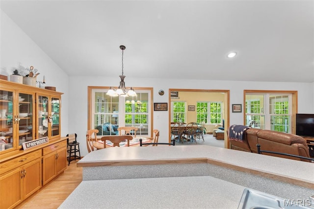 102 Timber Ln, Farmington, MO 63640 - kitchen with light countertops, pendant lighting, a chandelier, light wood-type flooring, and open floor plan