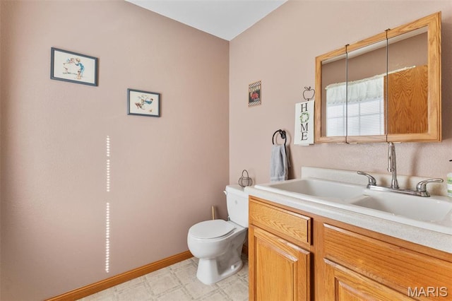 102 Timber Ln, Farmington, MO 63640 - half bathroom featuring toilet, vanity, tile patterned floors, and baseboards
