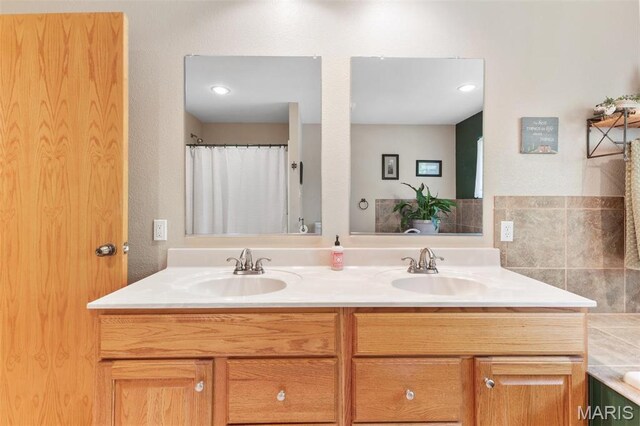 102 Timber Ln, Farmington, MO 63640 - bathroom with double vanity, a tub to relax in, and curtained shower
