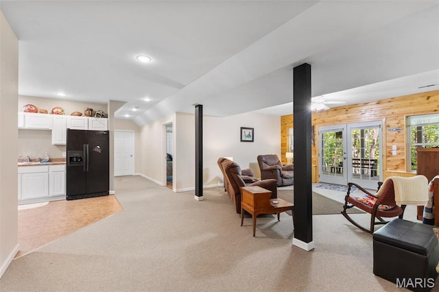 102 Timber Ln, Farmington, MO 63640 - living room featuring baseboards, light carpet, recessed lighting, wooden walls, and french doors