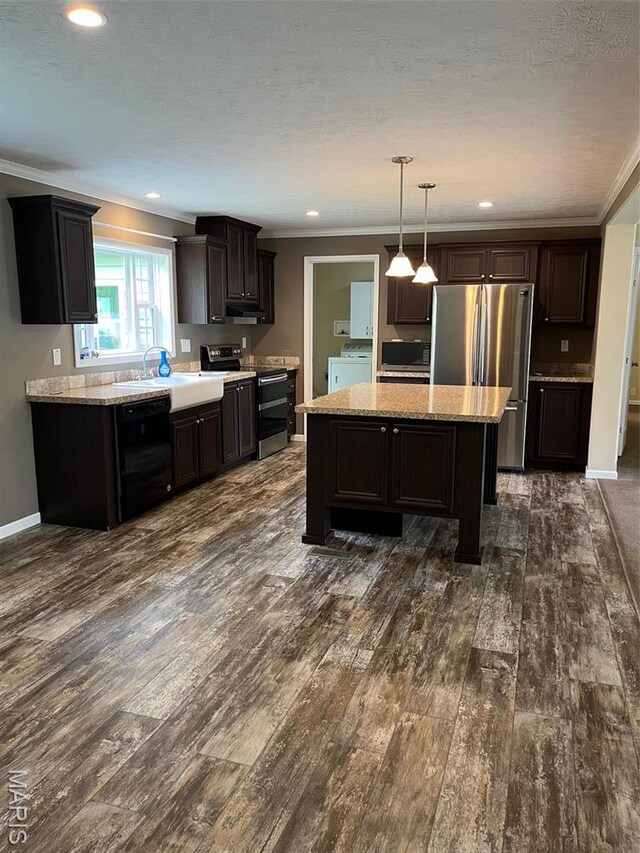 474 Bluffview Dr, Piedmont, MO 63957 - kitchen with stainless steel appliances, dark wood-style floors, ornamental molding, a center island, and light stone counters